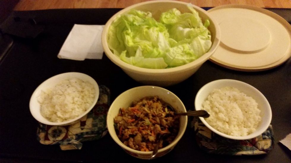 Serve with rice. To make the wrap: put a small amount of rice on a piece of lettuce then put meat and veg mix on top. Consume in one bite. Delicious!