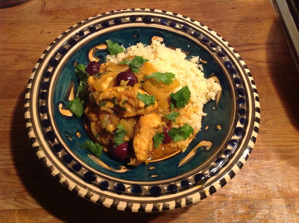 Serve with steamed  and buttered couscous with spicy Harissa on the side if liked.  I believe that traditionally this would be served with bread.