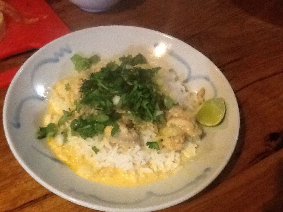 Serve with steamed rice and top with coriander, spring onion, chilli and lime.