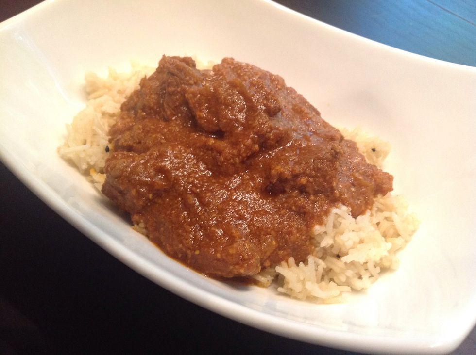 Serve with your choice of rice or bread. Enjoy :) Also if you want it really hot you can add more chili powder or throw in some fresh chili peppers when you are blending up the coconut mixture.