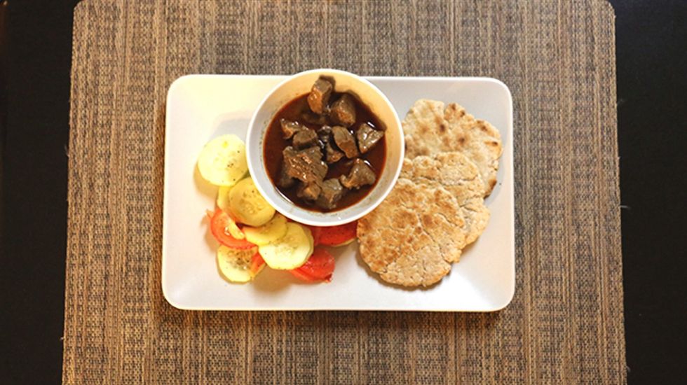 Service the Roti with a nice Beef curry with gravy and a cucumber salad made with salt, black pepper, tomato and a dash of lime (not lemon). Delicious.