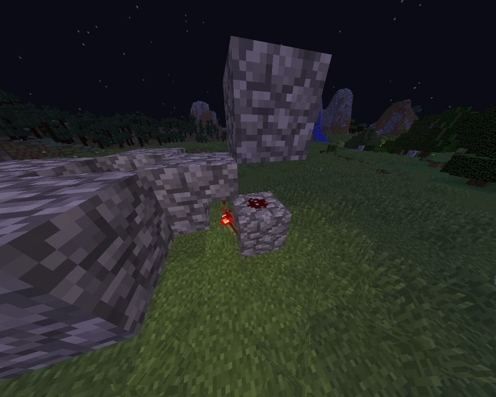 Set a redstone on the stone block and a redstone torch