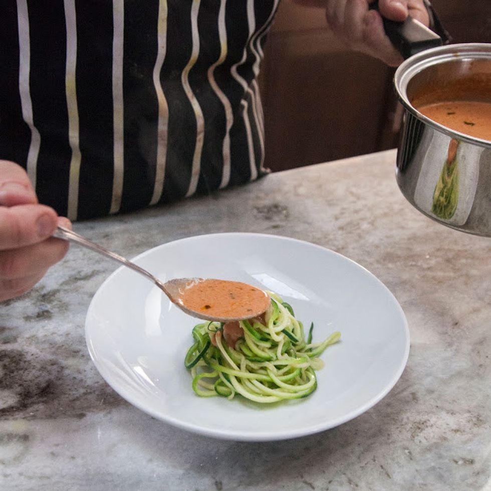 Set a serving of pasta up in a pasta bowl, and drizzle the warm spicy tomato sauce over it.
