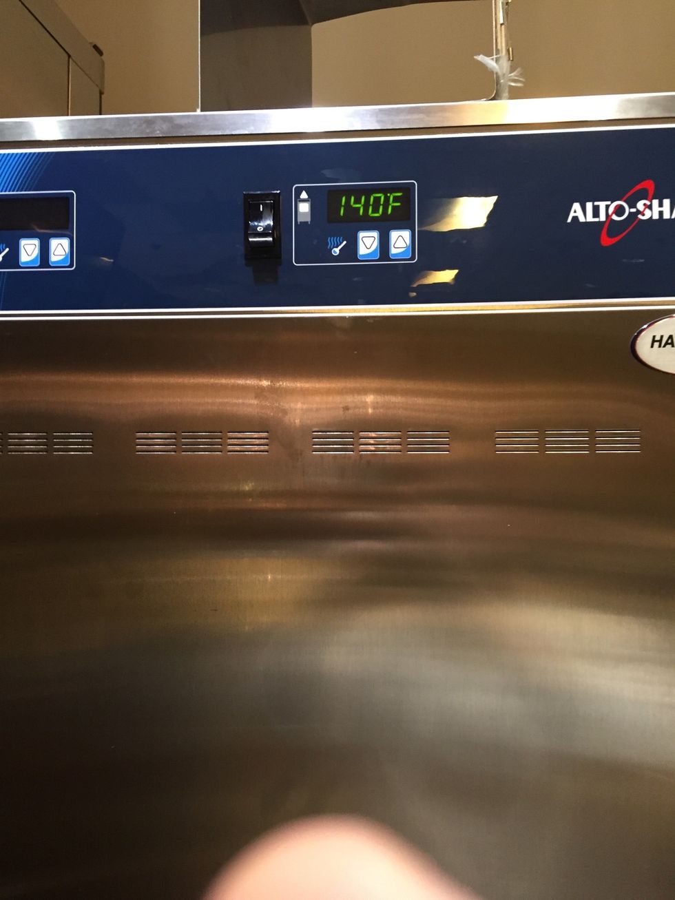 Set Alto Shaam cook and hold or holding cabinet to 140F (60C) with vents open.