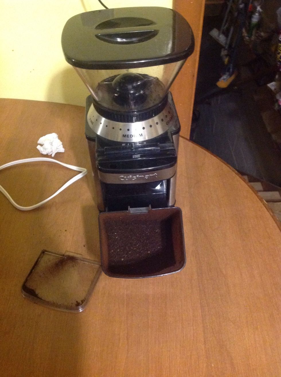 Set Burr grinder to medium grind and press start.