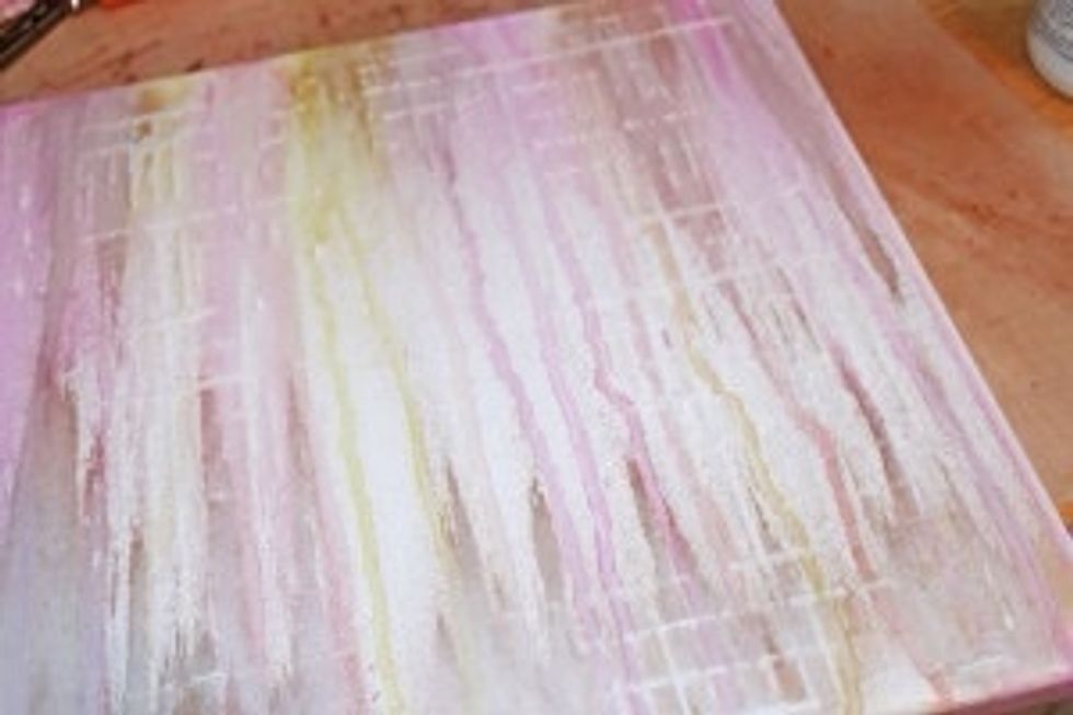 Set canvas aside to dry.   Tip: Pull stencil up and quickly slip it into water or clean it before the molding past hardens on it.