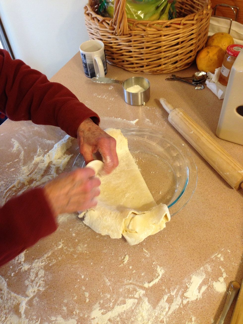Set dough half way into pie dish.