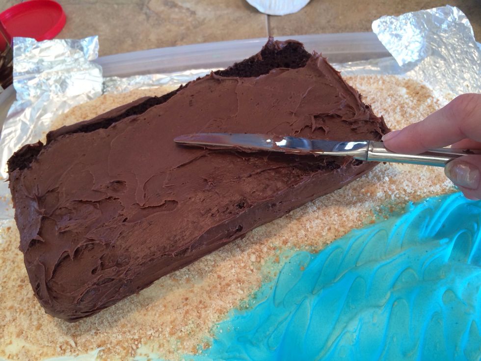 Set it into place on the base and frost the top.