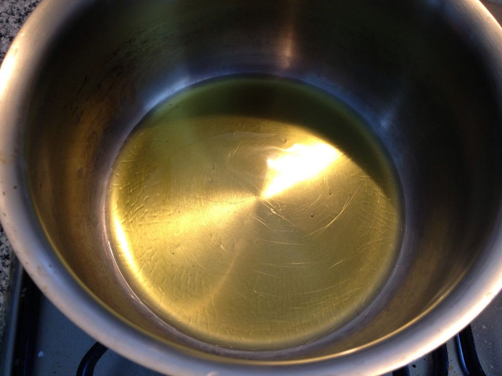 set low fire to a pot and heat some olive oil