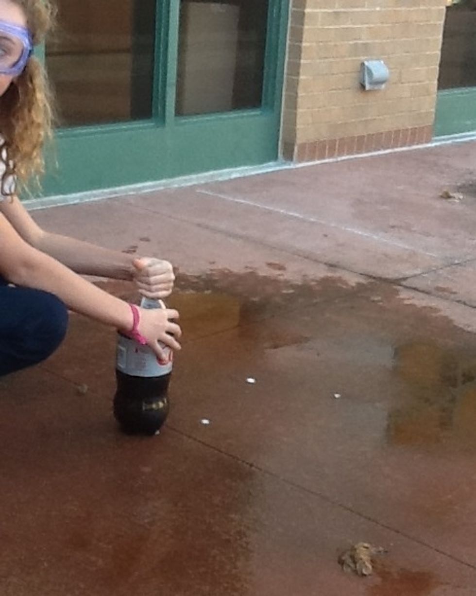 Set one bottle of room temperature Diet Coke on the "launch spot"