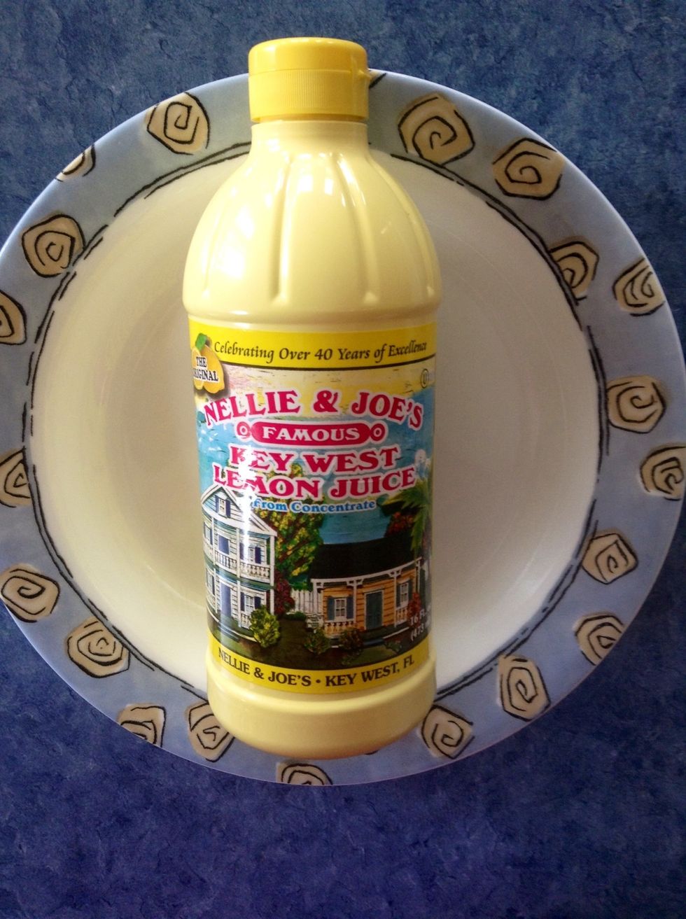 Set out a small shallow bowl, and pour a few small squirts of lemon juice into it.