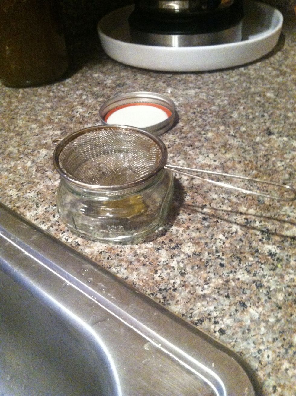 Set out your container. * I'm using a cute mason jar. And your small strainer.