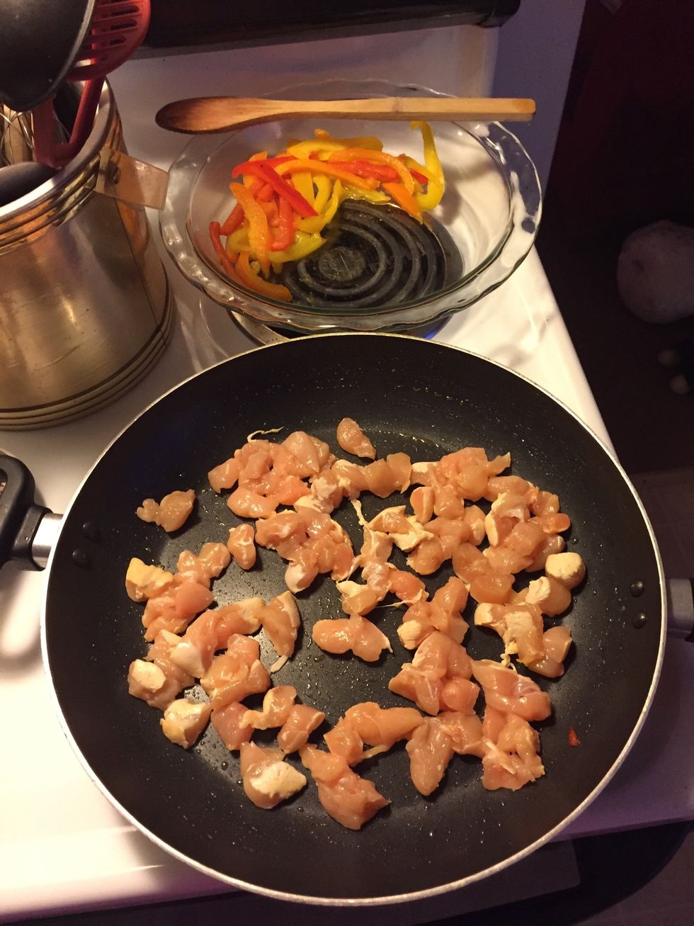 Set peppers aside and let chicken cook in the same pan on medium-high heat