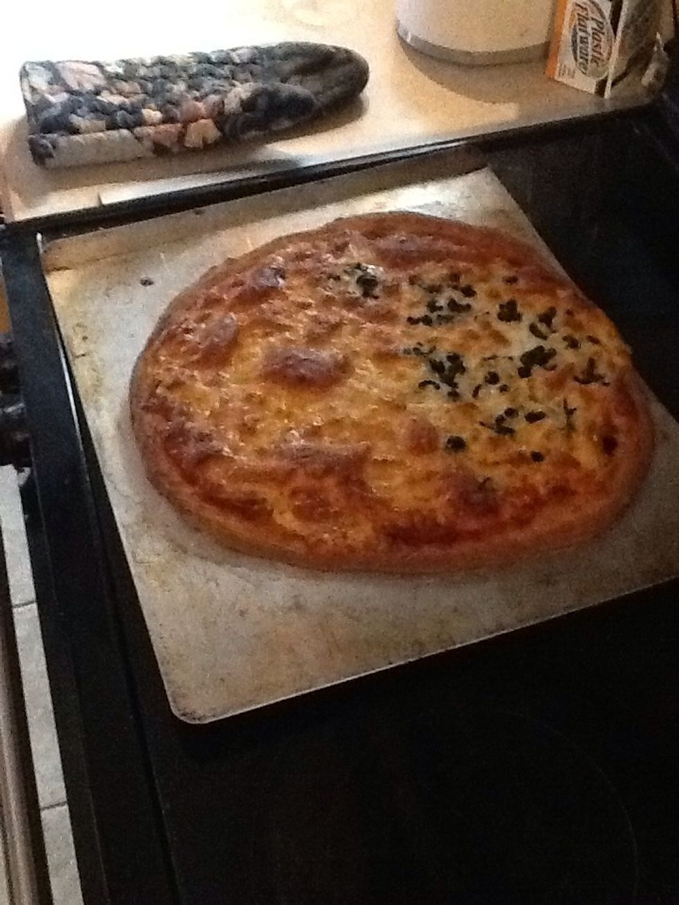 Set pizza on table or flat surface.