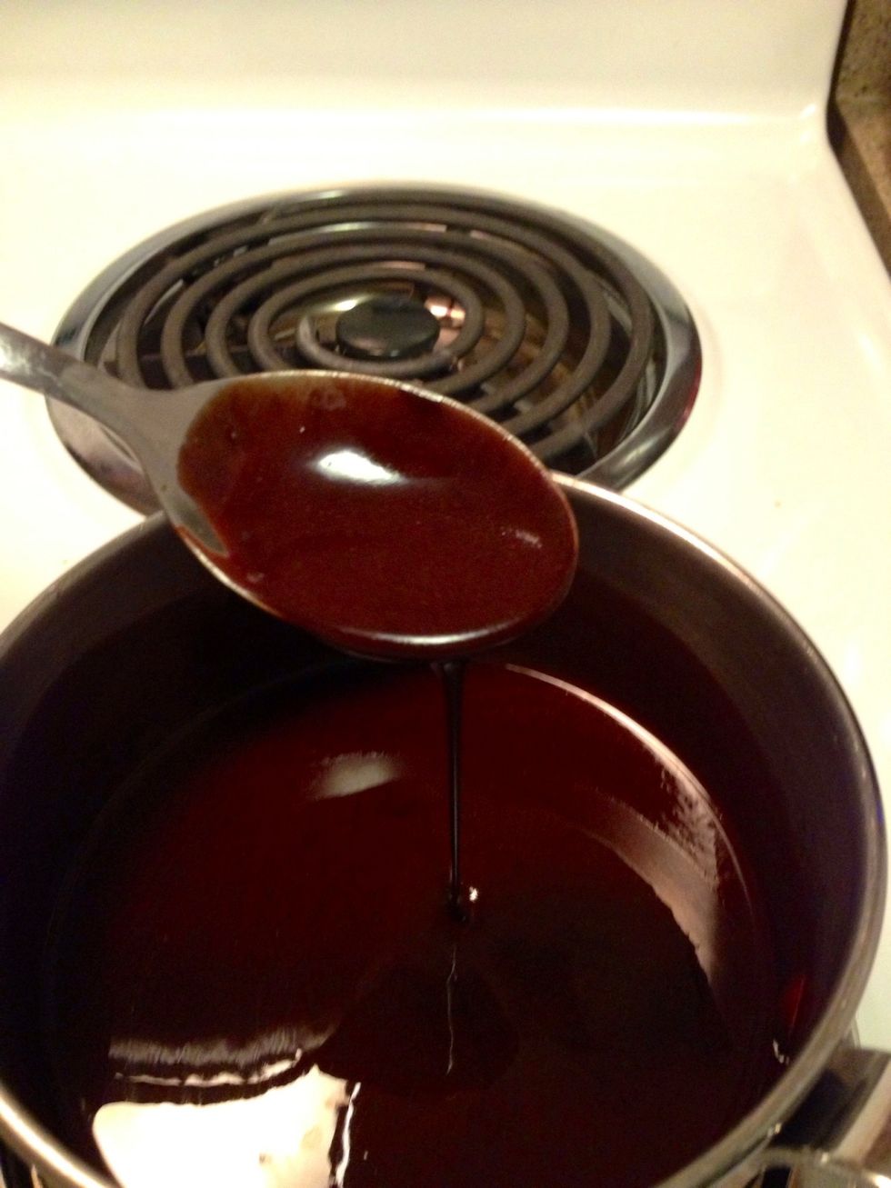 Set stove top to low and gently melt butter and unsweetened chocolate together stirring slowly but continually until it becomes glossy, lump free and smooth.