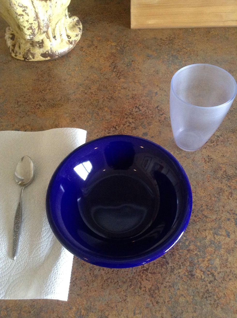 Set table with napkins, spoons, bowls, and cups