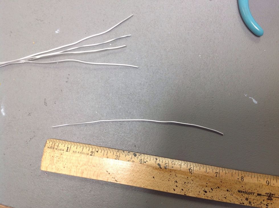 Set the 4 wires aside and cut a smaller piece of wire to make a handle for the top of our cage.