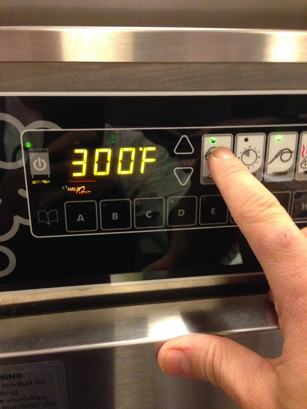 Set the cooking temperature to 300F (149C) by pressing this button and then adjusting with the up and down arrows.
