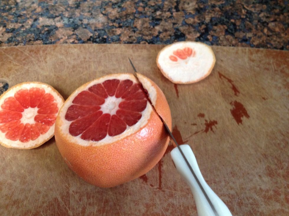 Set the grapefruit on one flat end. Start at the top and cut off the peel, following the curve of the fruit.