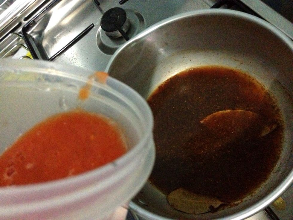 Set the heat to low. Add in the tomatoes garlics mixture. Stirring slowly