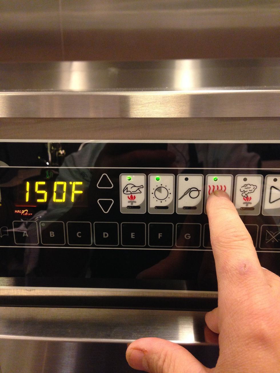 Set the hold temperature to 150F (65C) by pressing this button and then adjusting with the up and down arrows.