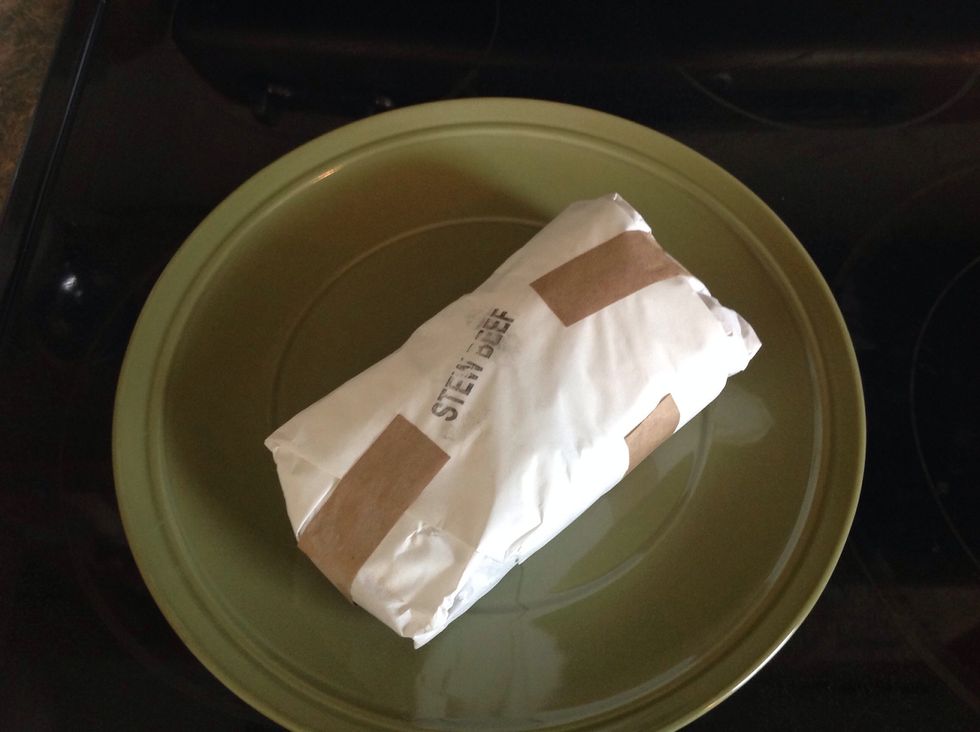 Set the meat on a plate to thaw.
