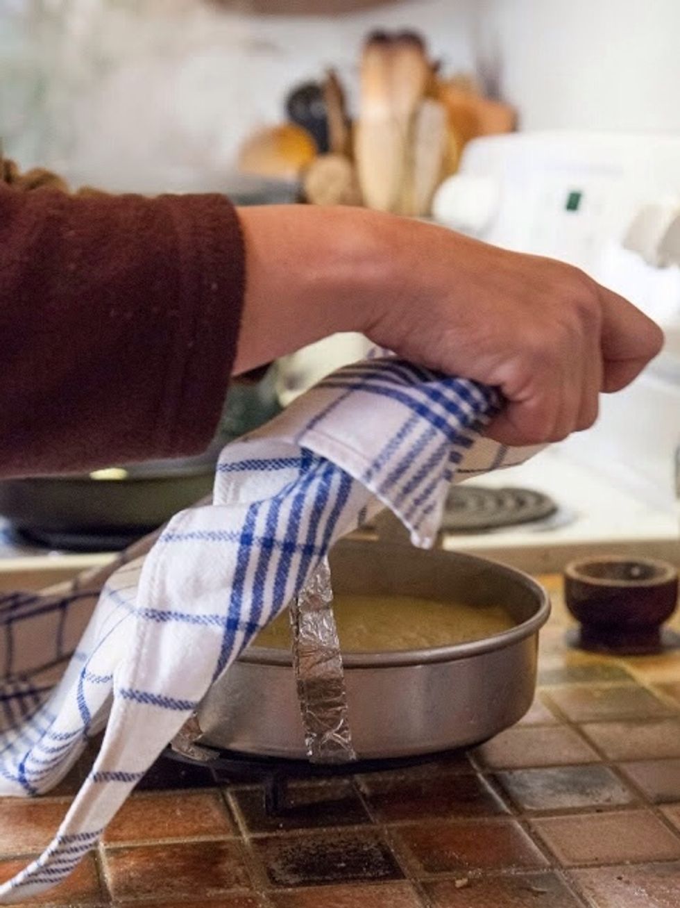 Set the pan aside with the towel set over it loosely. Keep it covered for about 10 minutes to rest. After 10 minutes, turn the bread out on to a plate.