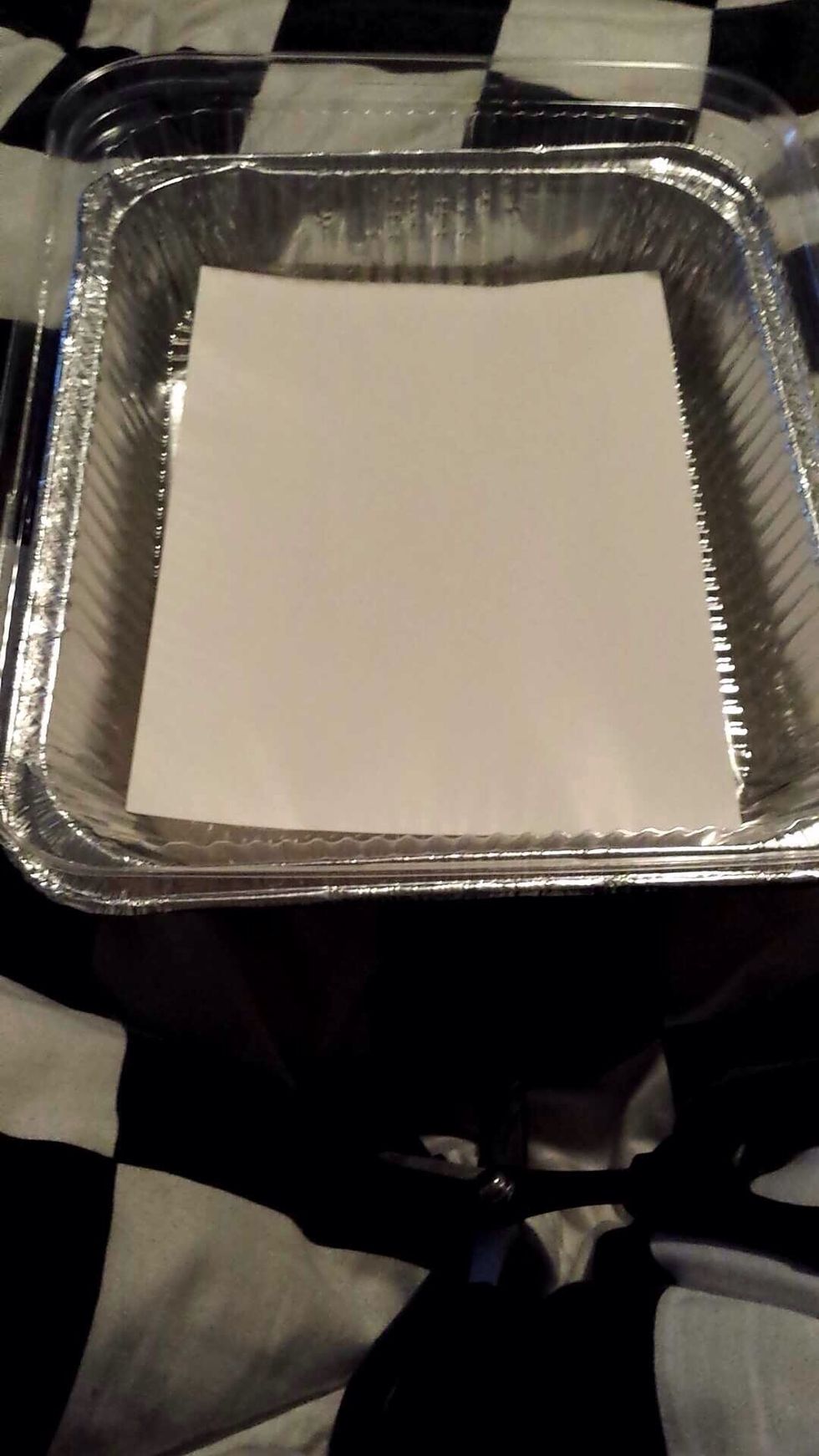 Set the poster board in the bottom of the pan.