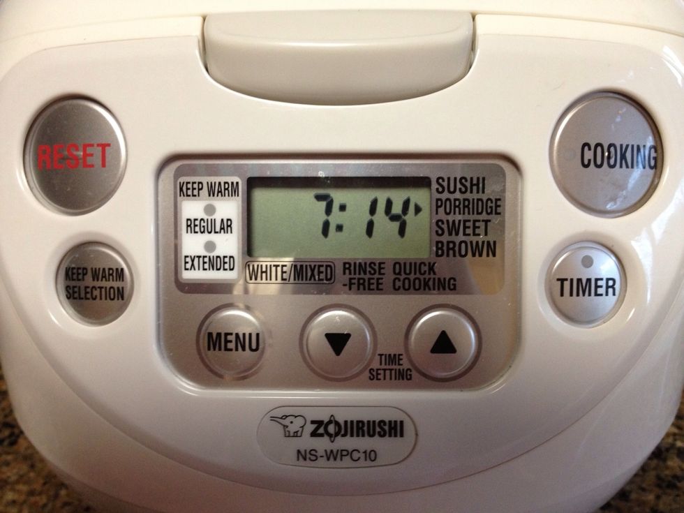 Set the rice cooker to porridge mode and start cooking. It will take about an hour.