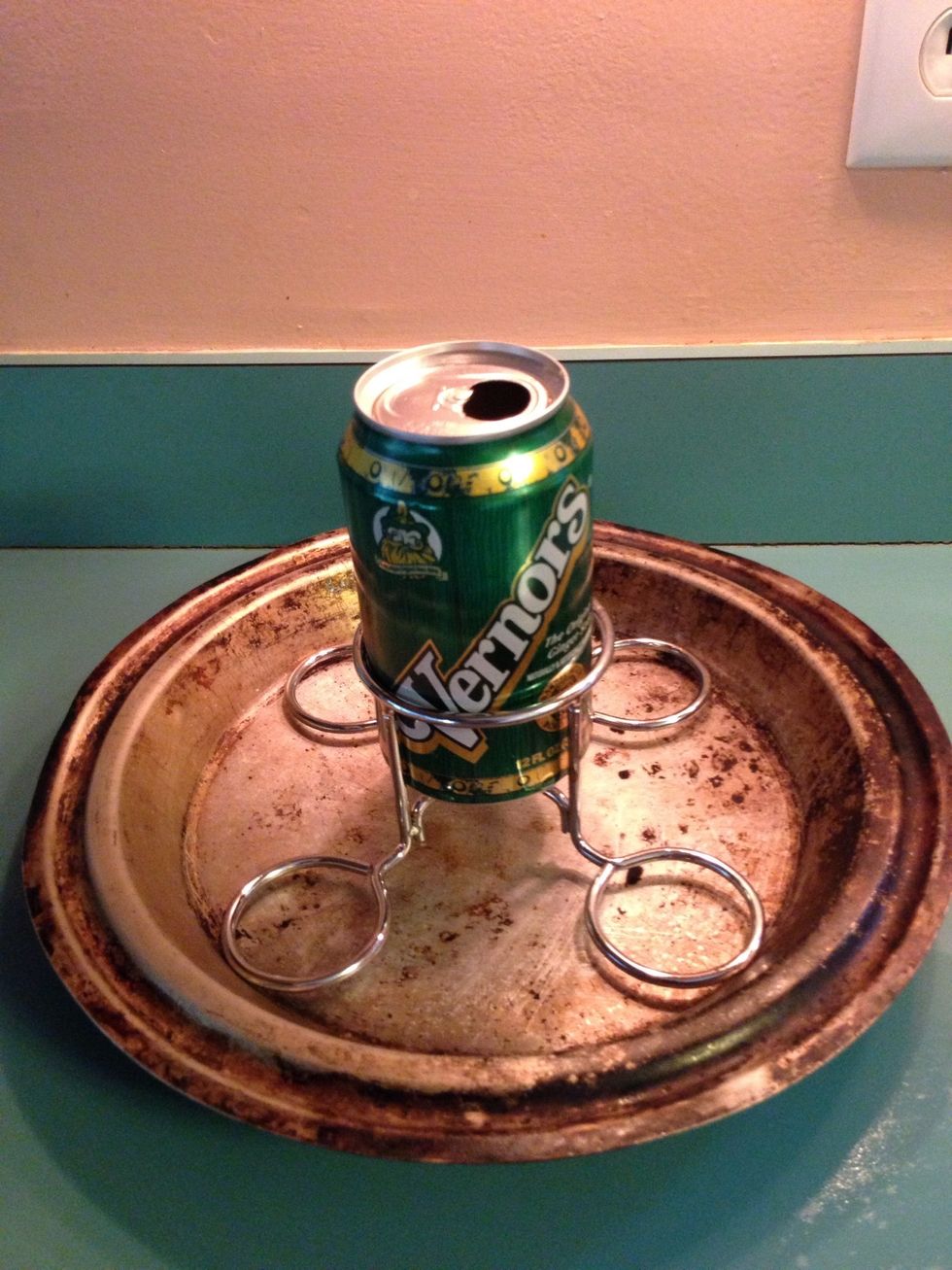 Set the seasoned ginger ale and holder into a shallow 9" metal pie pan. Hint: this is going on the grill and the pie pan won't look new after you're done with this process.