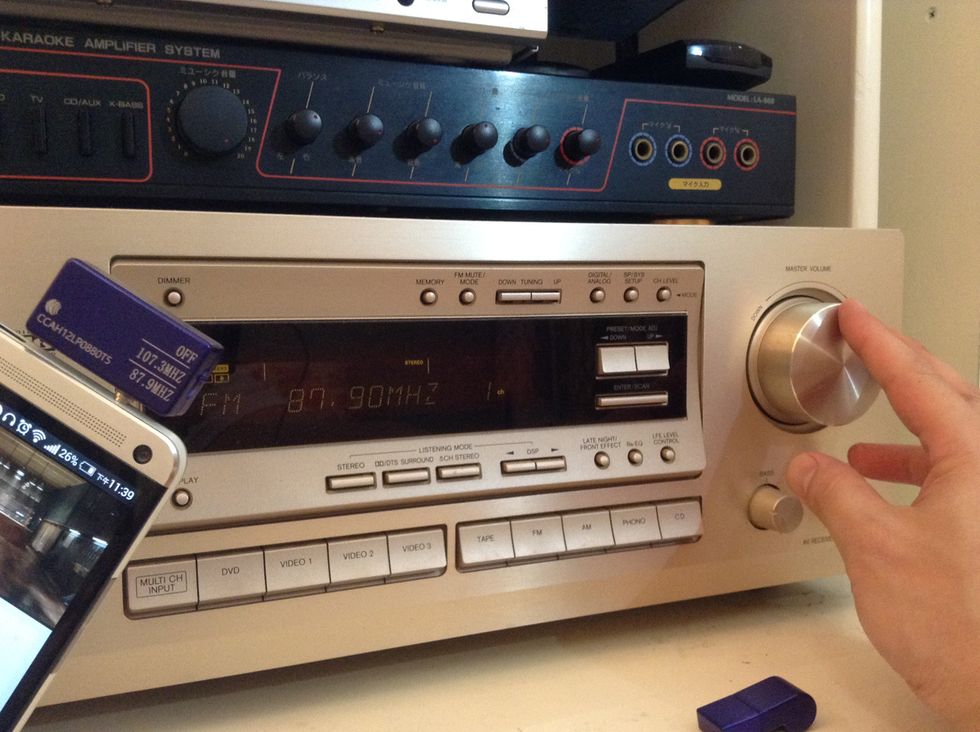 Set the volume of the phone to about 80%. You can then use the remote or volume control of the home stereo to control the sound output.