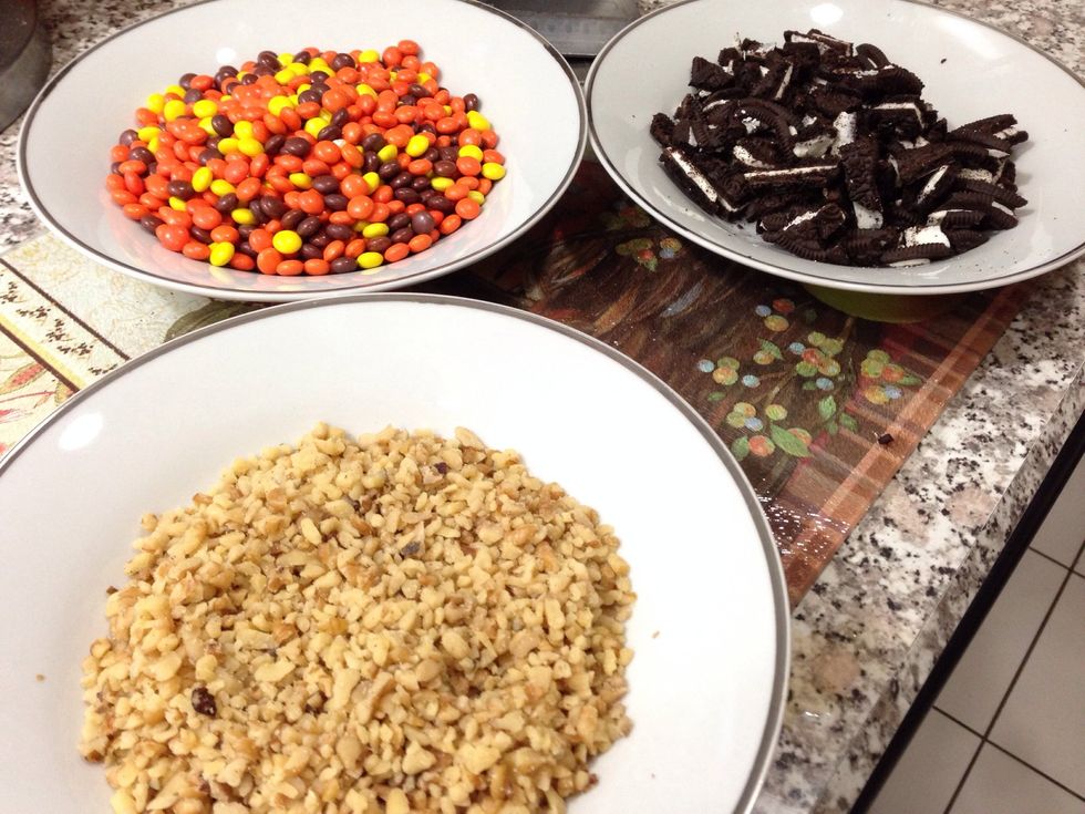 Set up your toppings next! Chop the Oreos and put them in a bowl along with the nuts and Reese's candies.