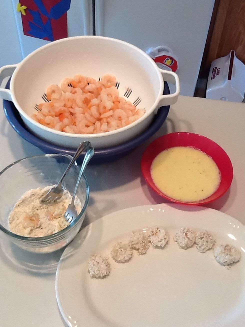 Set up your work station.  Dip shrimp in breadcrumb mixture, then egg, then back into breadcrumbs, then lay on plate.  If you need more breadcrumbs, just make another batch (that's what I had to do!)