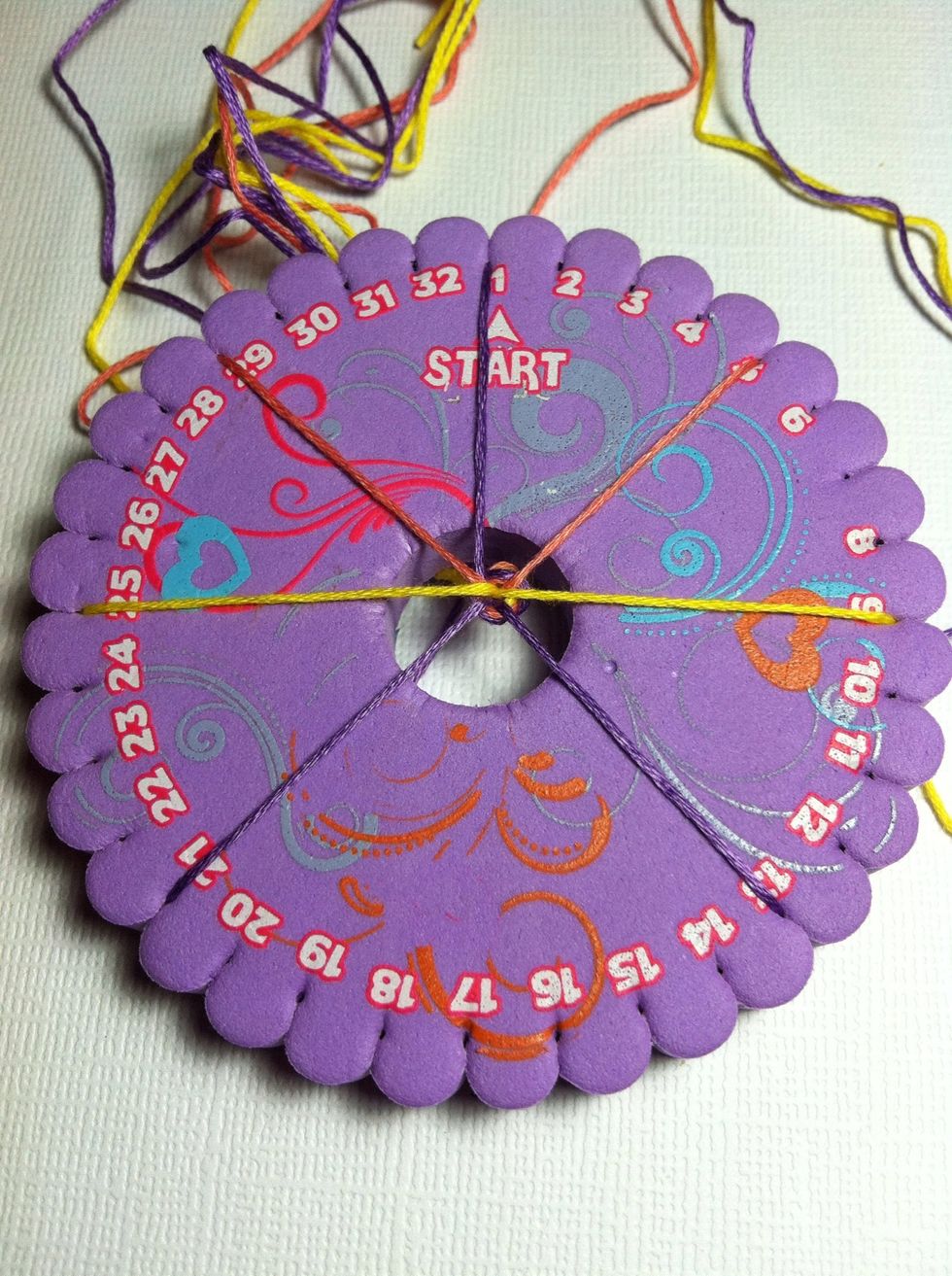 Set you strings in groups of 1 spaced evenly apart, leaving space for a ghost string. On a 32 slot wheel with 7 strings, space then 3 slots apart, leaving a gap of 7 slots at the bottom.