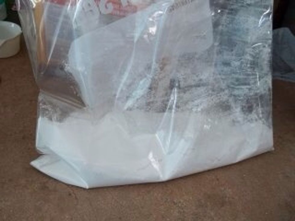 Set your chex mix aside and get a extra large zip lock bag. Fill with powdered sugar :)