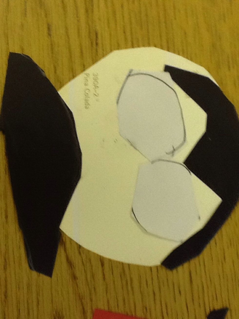 Seventh  cut out the black part of the eyes and glue the black part inside the white part