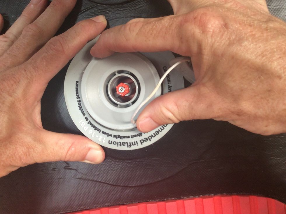 Seventh, it's time to put the valve back in.  So, press down with one hand, and finger tighten with the other. Use your fingers and not the wrench initially so you don't cross-thread. Turn clockwise.