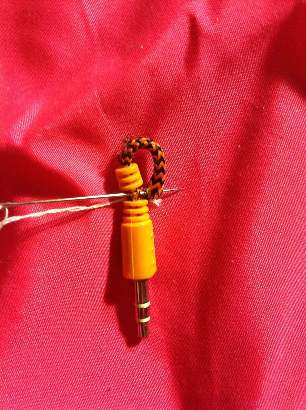 Sew 3-4 times threw until string is gone or until you feel it's enough. Then tie a not on the end of the string and cut it off