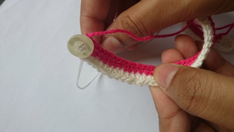 Sew a button at the end of the bracelet.
