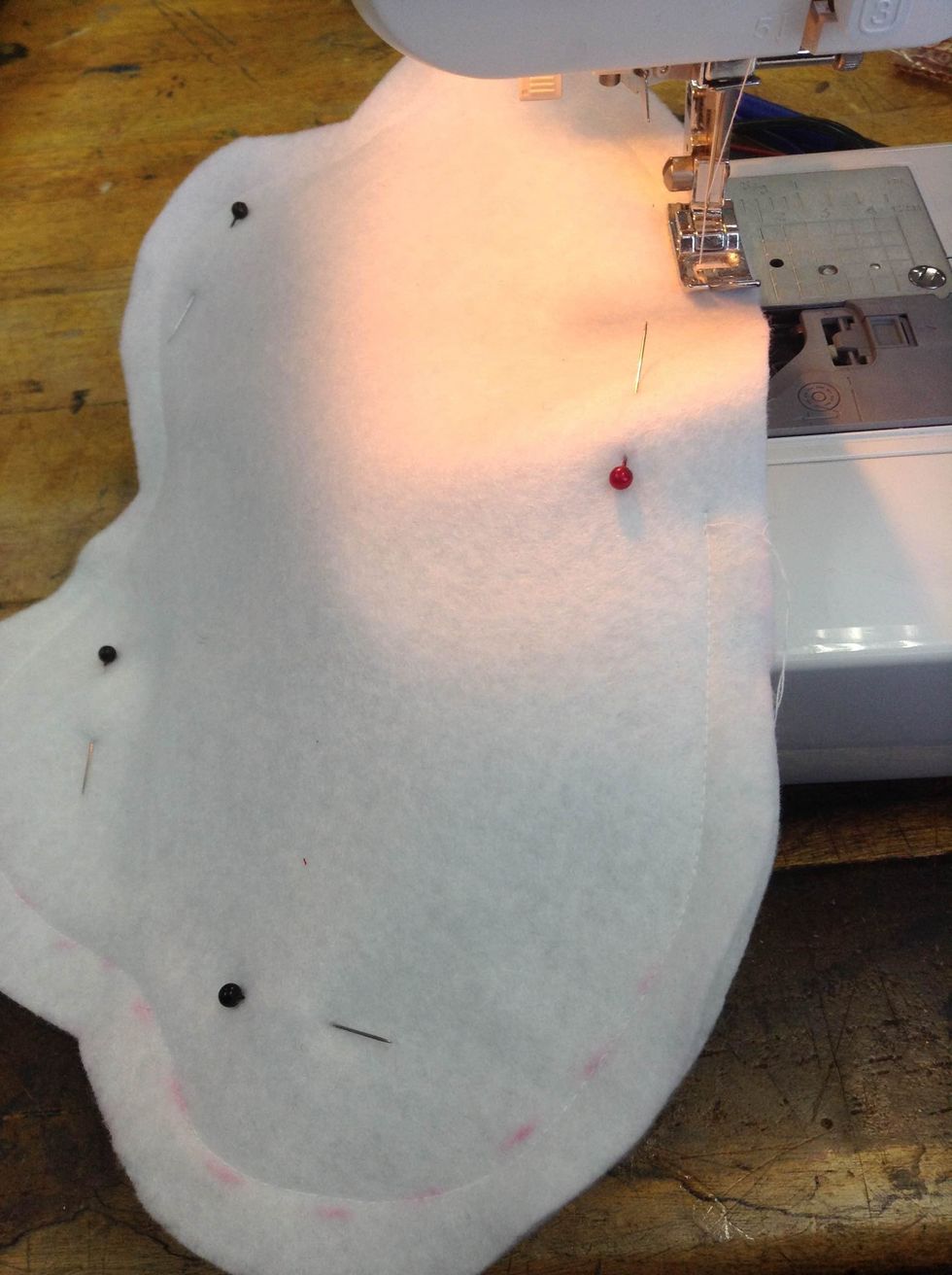 Sew all around your monster but leave a space/hole for inserting the filling. Remove the pins and cut the left over threads.