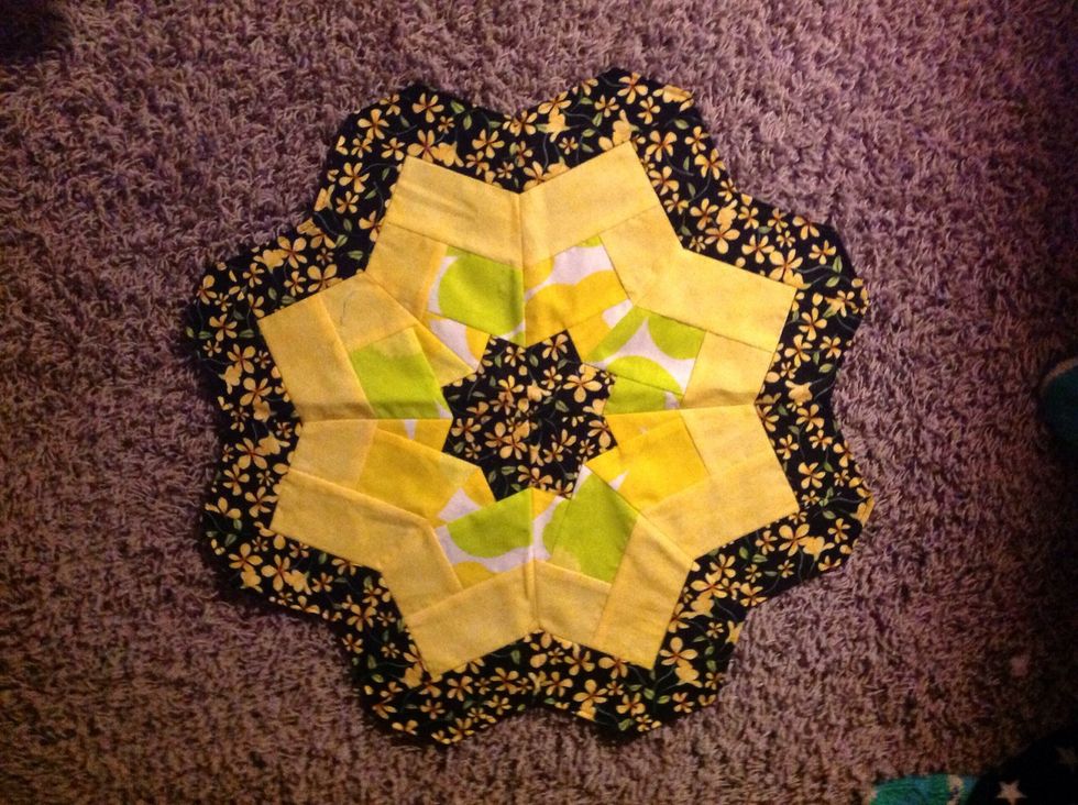 Sew all eight blocks together and the flower block is ready. I made a table gloth.