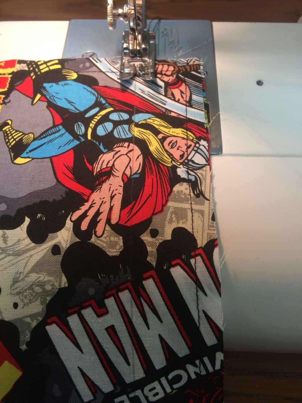 Sew along the line across the bottom of the pockets