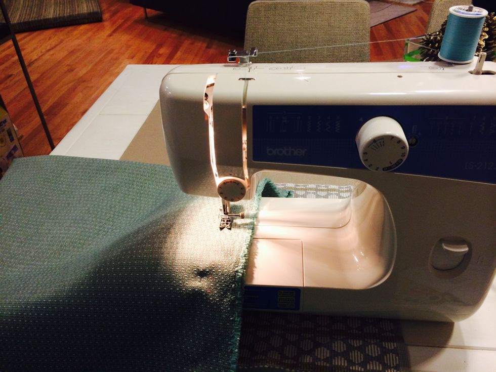 Sew along the pins on both sides of the fabric. Leave one side open to slip the mattress in