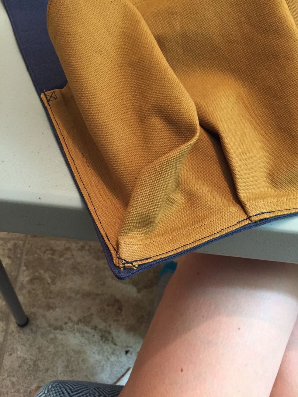 Sew around edge of bottle holder to fasten to body of holder. Make sure to reinforce at corners.