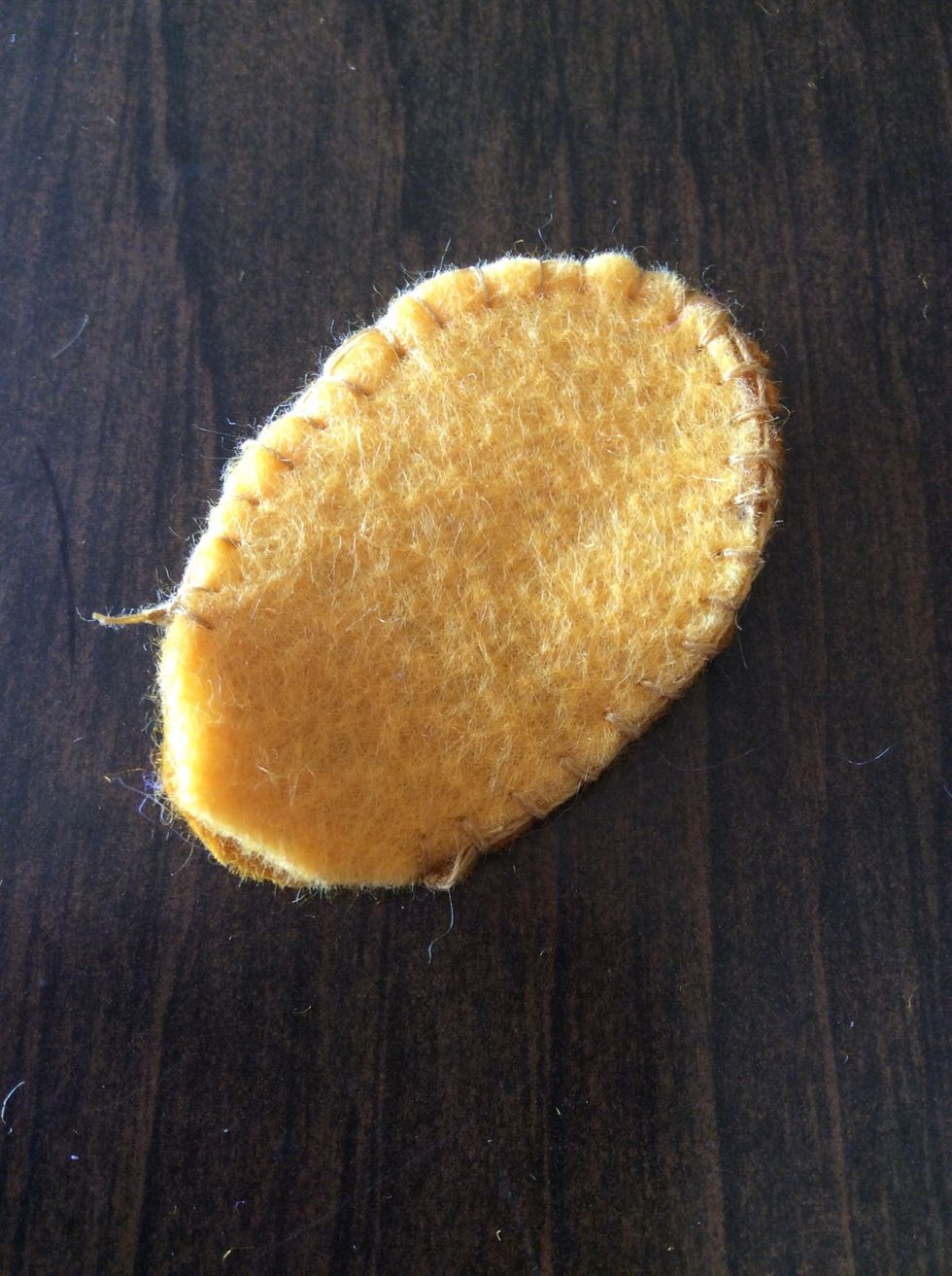 Sew around the edge with a blanket stitch (minus the bottom).