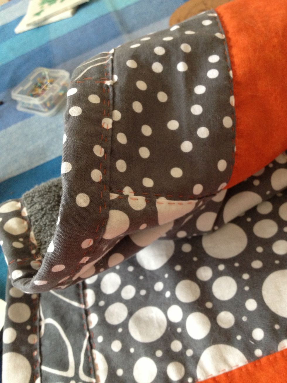 Sew binding to mat, making sure raw edges are covered.