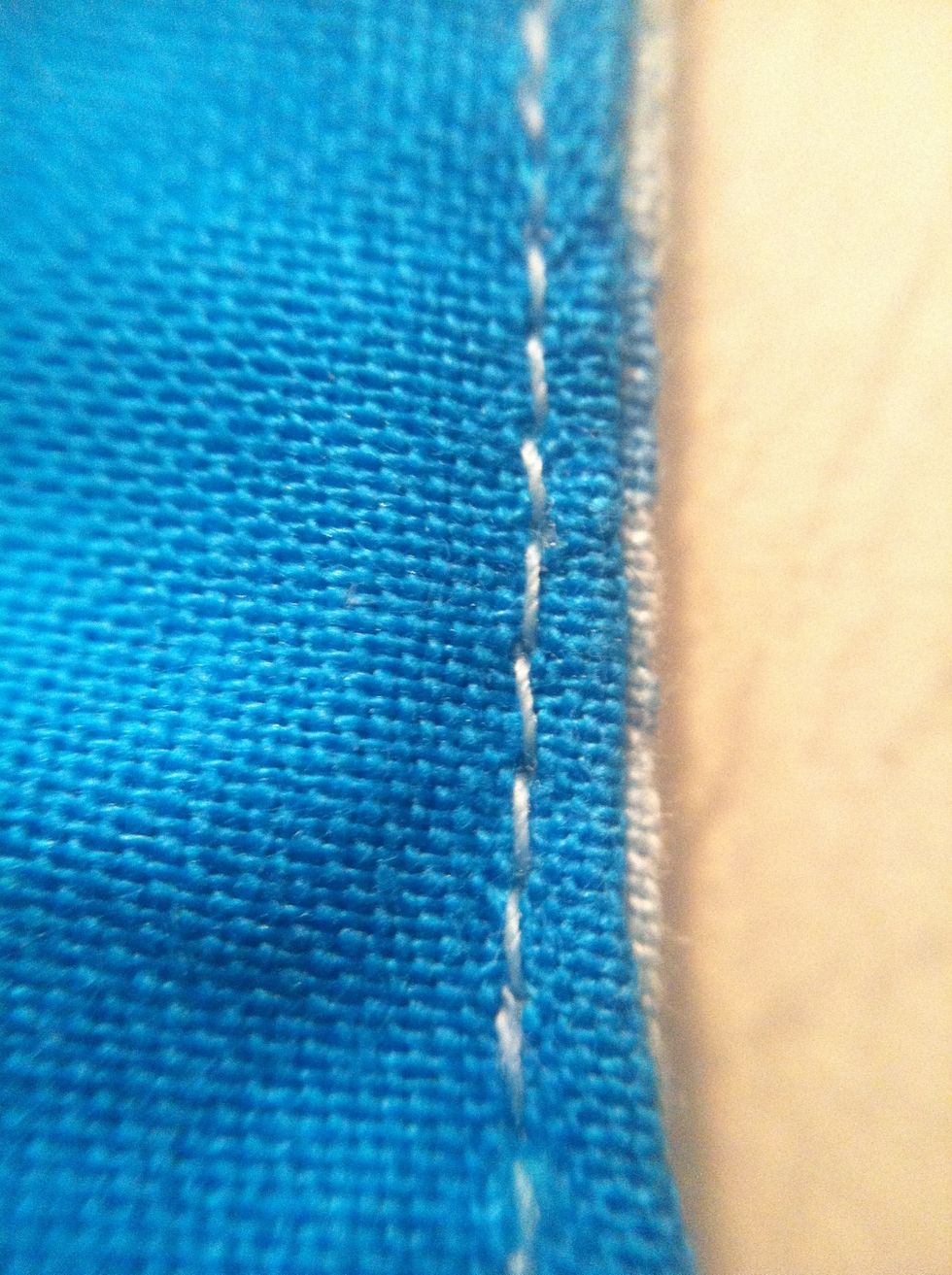 Sew close to the edge of where you folded it, but only sew three sides. The side you don't sew, you will use to put the cardboard or wadding (or both) in.