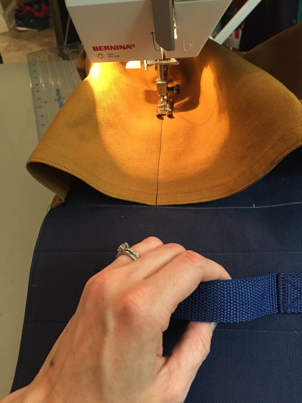 Sew down perpendicular to top line and bottom of body piece until the mark, then reverse.