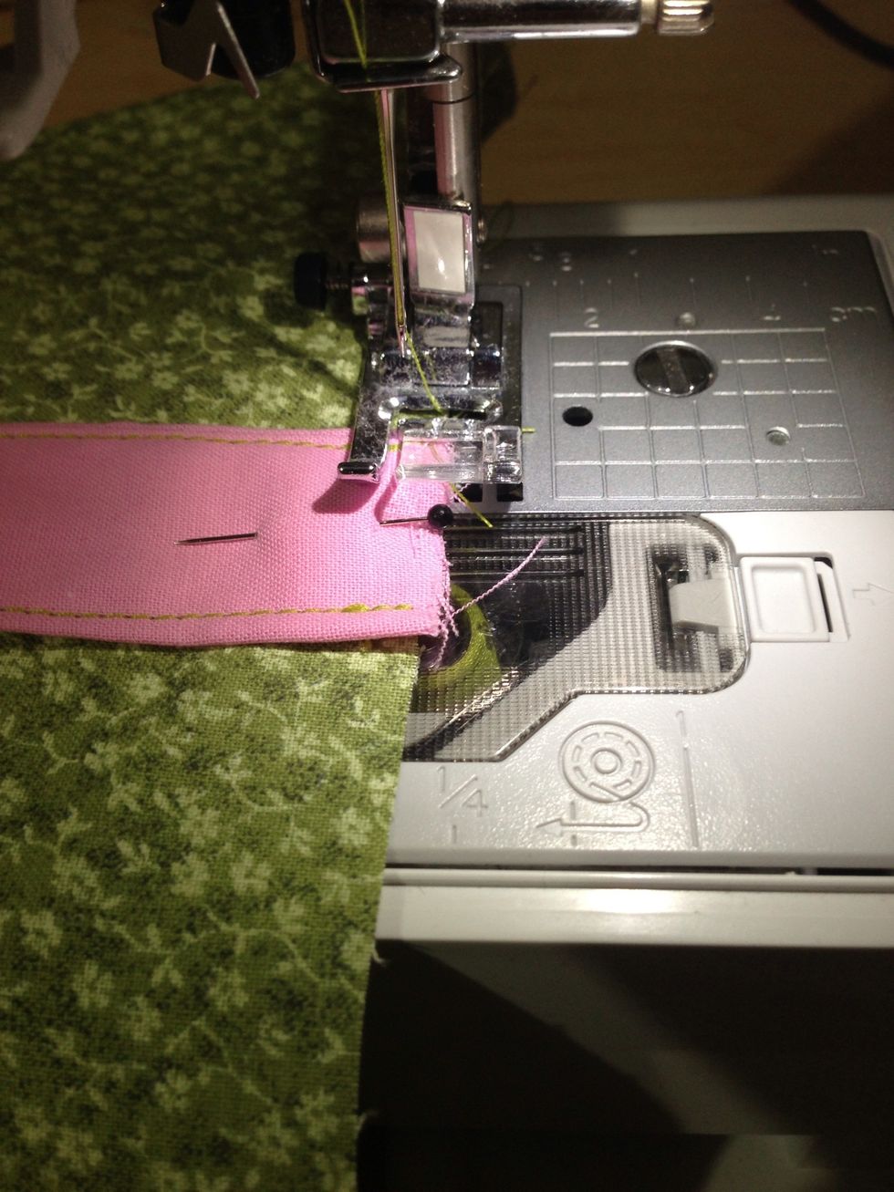 Sew handle in place using a 1/4 in seam allowance. I sew and then backstitch over what I just sewed. Repeat on other side of handle.