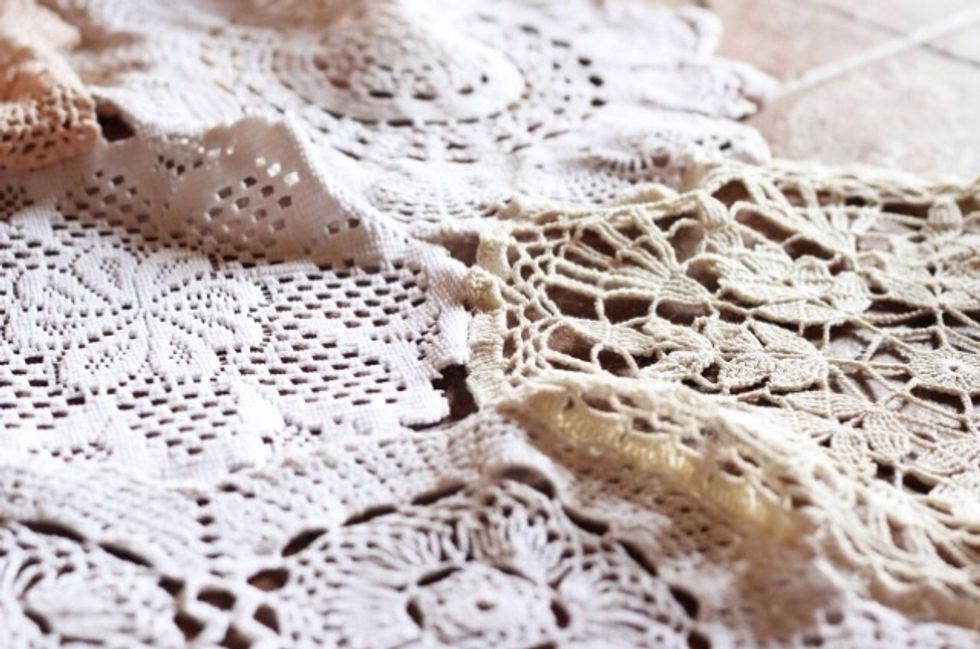 Sew lace or doilies together into a curtain shape of your desired length.